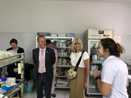 Christine Middlemiss and Gareth Ward being shown the laboratory