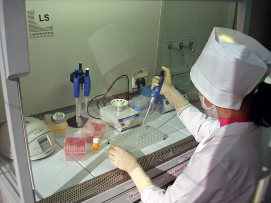 Lab specialist working on avian influenza