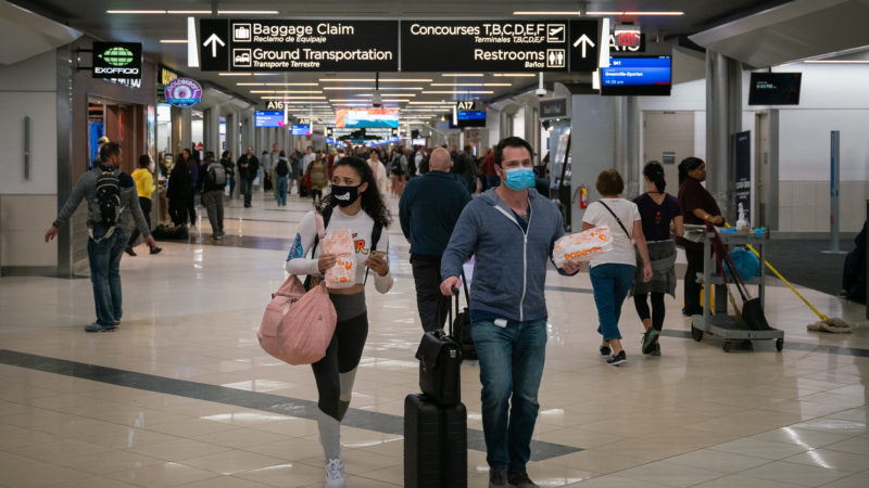 People wearing face masks in an airport