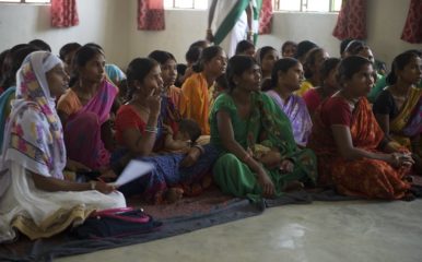 Seated women at a community engagement event