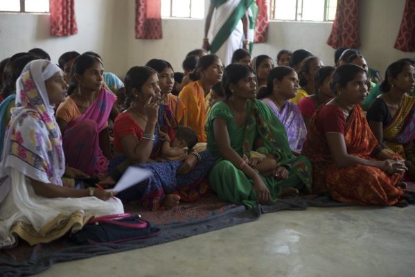 Seated women at a community engagement event