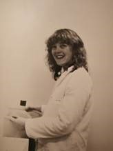a young Professor Fiona Tomley in white lab coat