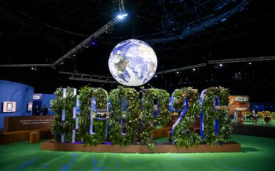 event display showing large model planet and large #COP26 sign