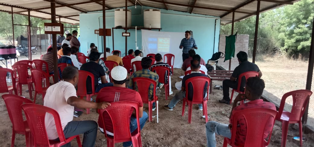 researcher addressing poultry stakeholders in a public engagement session