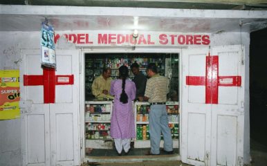 people being served at a roadside pharmacy