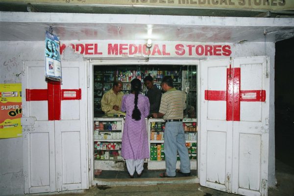 people being served at a roadside pharmacy